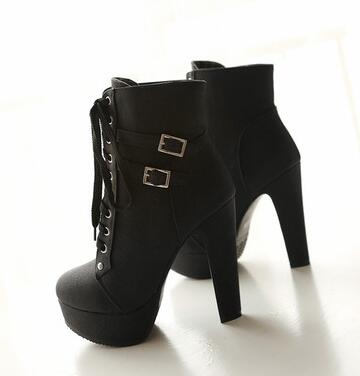 The patent leather block heel ankle boot.