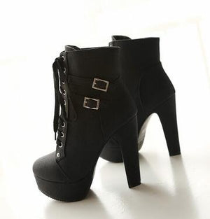 The patent leather block heel ankle boot.
